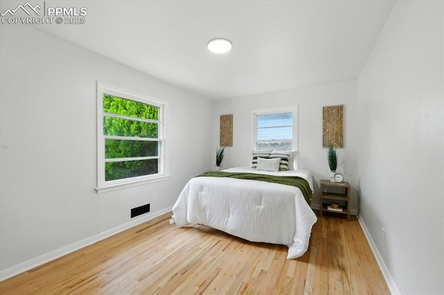 1314 Pioneer Rd, Colorado Springs, CO 80907 - bedroom featuring wood finished floors and baseboards