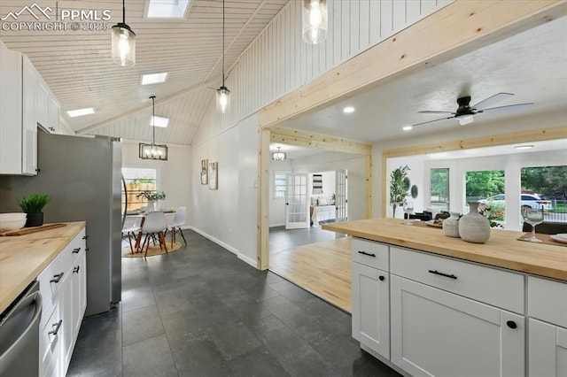 1314 Pioneer Rd, Colorado Springs, CO 80907 - kitchen with wood counters, appliances with stainless steel finishes, plenty of natural light, recessed lighting, and high vaulted ceiling