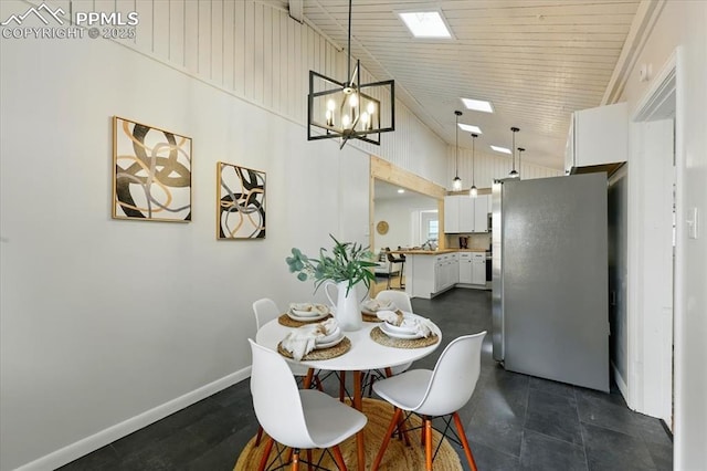 1314 Pioneer Rd, Colorado Springs, CO 80907 - dining room with a chandelier and high vaulted ceiling