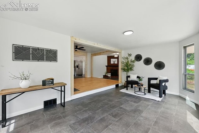 1314 Pioneer Rd, Colorado Springs, CO 80907 - sitting room with baseboards and a fireplace