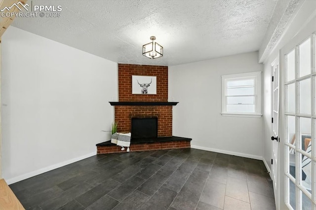 1314 Pioneer Rd, Colorado Springs, CO 80907 - unfurnished living room with a textured ceiling and a brick fireplace