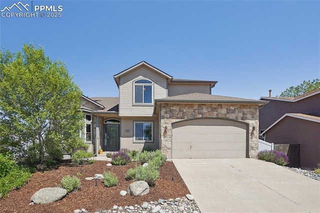 392 Pyrite Ter, Colorado Springs, CO 80905 - view of front of property featuring stone siding, an attached garage, and concrete driveway