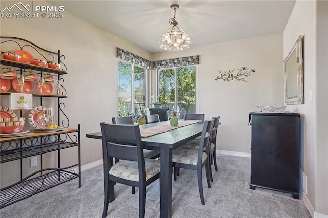 392 Pyrite Ter, Colorado Springs, CO 80905 - dining area with carpet flooring and a chandelier