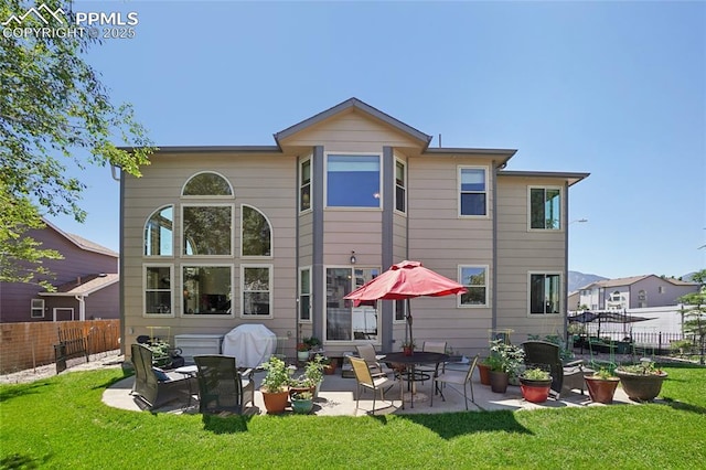 392 Pyrite Ter, Colorado Springs, CO 80905 - rear view of house with a patio area and a fenced backyard