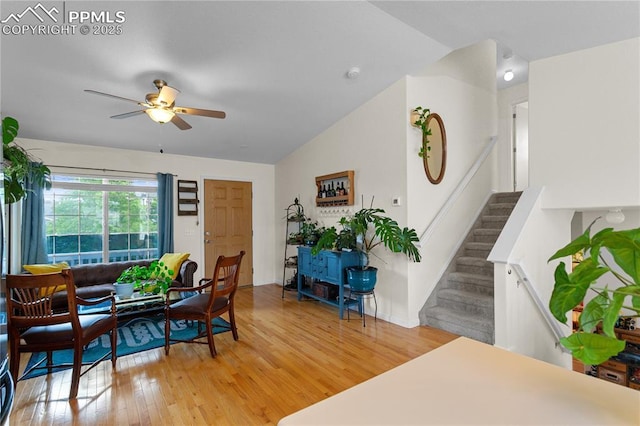 6355 Casual Dr, Colorado Springs, CO 80923 - living area featuring a ceiling fan, light wood-style flooring, stairway, and lofted ceiling