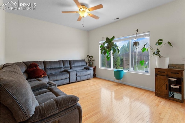 6355 Casual Dr, Colorado Springs, CO 80923 - living area featuring wood finished floors and ceiling fan