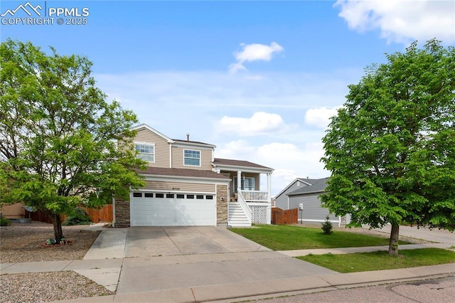 6355 Casual Dr, Colorado Springs, CO 80923 - traditional home with stone siding, stairs, concrete driveway, and a garage