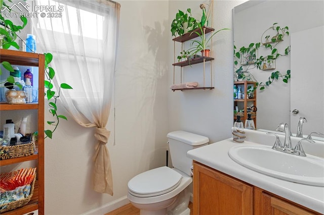 6355 Casual Dr, Colorado Springs, CO 80923 - bathroom with toilet and vanity
