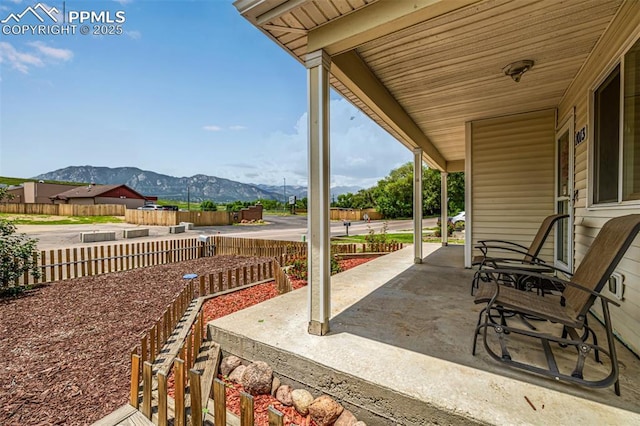 1013 Maxwell St, Colorado Springs, CO 80906 - covered porch featuring a mountain view