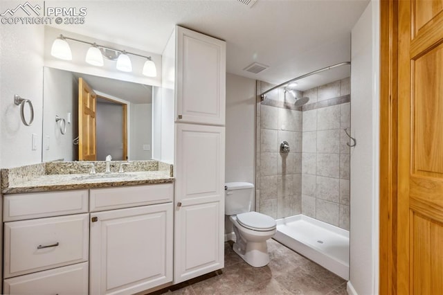 16575 Dancing Wolf Way, Colorado Springs, CO 80908 - bathroom with vanity and a tile shower