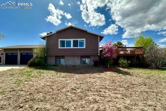 4110 Novia Dr, Colorado Springs, CO 80911 - rear view of property with a deck and an attached garage