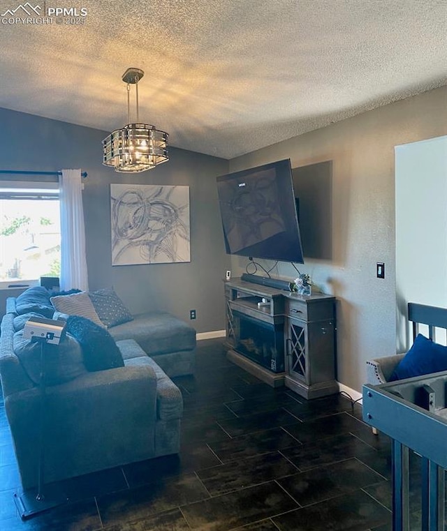 4110 Novia Dr, Colorado Springs, CO 80911 - living room featuring a textured ceiling and a chandelier
