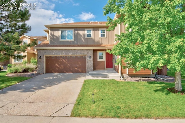 3355 Willowrun Dr, Castle Rock, CO 80109 - view of front of house with board and batten siding, driveway, a front lawn, a garage, and brick siding