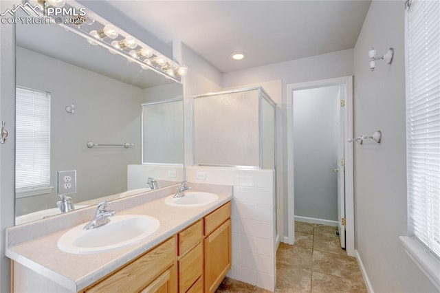 3355 Willowrun Dr, Castle Rock, CO 80109 - full bathroom featuring double vanity, a shower stall, and recessed lighting
