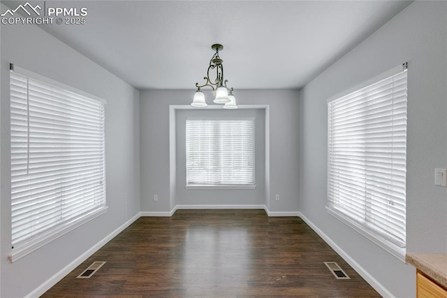 3355 Willowrun Dr, Castle Rock, CO 80109 - empty room with dark wood-type flooring and a chandelier