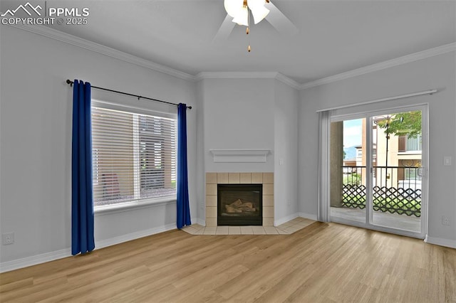 4888 Kerry Lynn Way Unit 101, Colorado Springs, CO 80922 - unfurnished living room featuring wood finished floors, ornamental molding, a tiled fireplace, and a ceiling fan