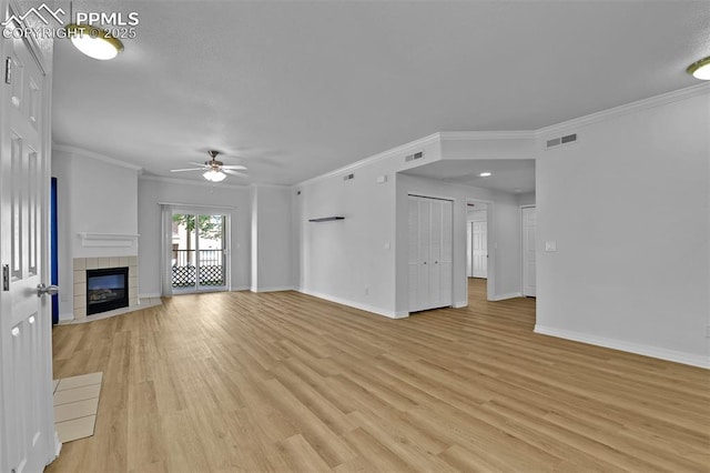 4888 Kerry Lynn Way Unit 101, Colorado Springs, CO 80922 - unfurnished living room with a ceiling fan, light wood finished floors, crown molding, a tile fireplace, and recessed lighting