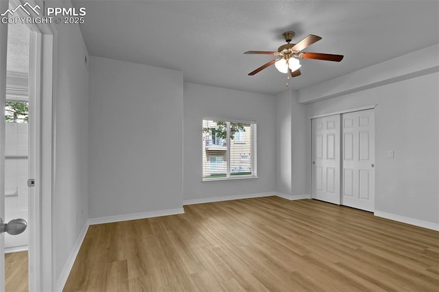 4888 Kerry Lynn Way Unit 101, Colorado Springs, CO 80922 - unfurnished bedroom featuring light wood-style flooring, a closet, and ceiling fan