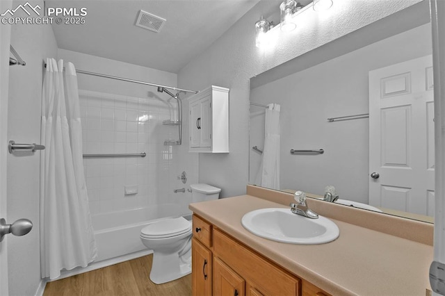 4888 Kerry Lynn Way Unit 101, Colorado Springs, CO 80922 - bathroom featuring shower / bathtub combination with curtain, wood finished floors, and vanity