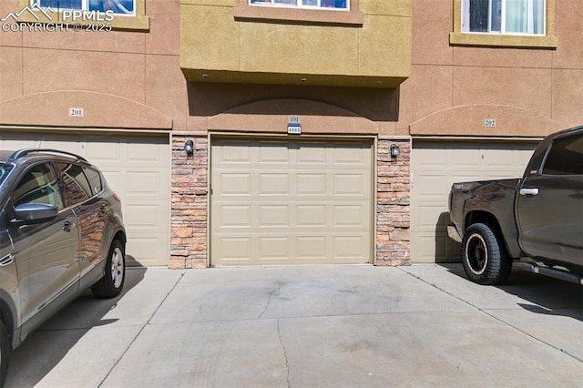 4888 Kerry Lynn Way Unit 101, Colorado Springs, CO 80922 - garage featuring driveway