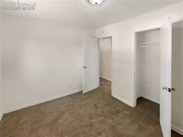 307 Mount View Ln, Fountain, CO 80817 - unfurnished bedroom with carpet, a closet, and a textured ceiling