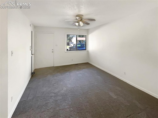 307 Mount View Ln, Fountain, CO 80817 - spare room featuring a ceiling fan and dark colored carpet