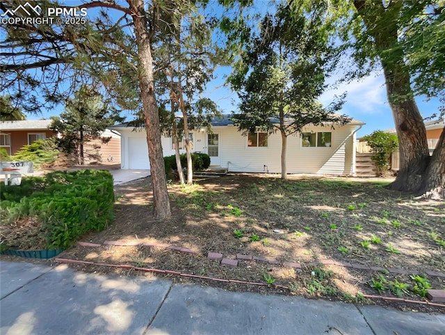 307 Mount View Ln, Fountain, CO 80817 - view of front facade with an attached garage and concrete driveway