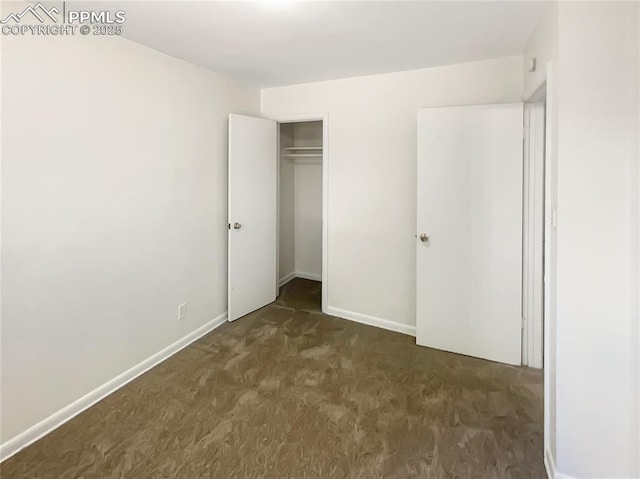 307 Mount View Ln, Fountain, CO 80817 - unfurnished bedroom featuring dark colored carpet and a closet