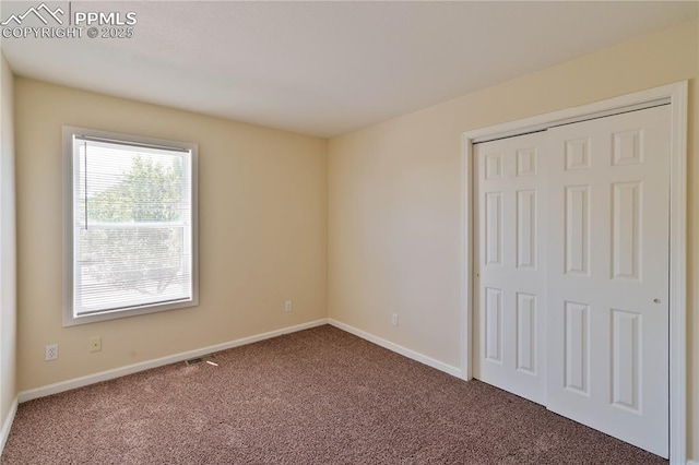 4400 Rawhide Rd Unit 157, Pueblo, CO 81008 - unfurnished bedroom featuring carpet and a closet