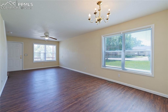 4400 Rawhide Rd Unit 157, Pueblo, CO 81008 - empty room with dark wood-style flooring, a chandelier, and a ceiling fan