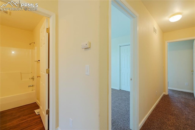 4400 Rawhide Rd Unit 157, Pueblo, CO 81008 - corridor with baseboards and dark carpet
