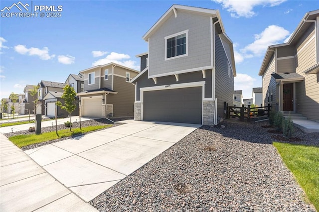 16423 Mountain Flax Dr, Monument, CO 80132 - view of front of property featuring a garage, a residential view, stone siding, and concrete driveway