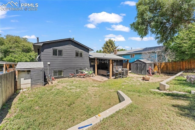 728 Squire St, Colorado Springs, CO 80911 - rear view of property with a storage unit and a fenced backyard
