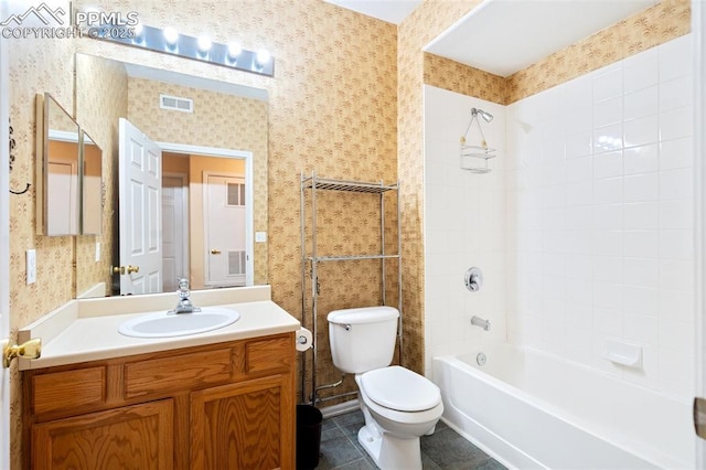 3847 Riviera Grv Unit 102, Colorado Springs, CO 80922 - bathroom featuring wallpapered walls, vanity, and shower / tub combination