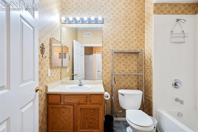 3847 Riviera Grv Unit 102, Colorado Springs, CO 80922 - full bathroom featuring wallpapered walls, vanity, and bathtub / shower combination