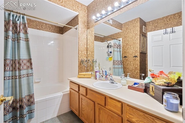 3847 Riviera Grv Unit 102, Colorado Springs, CO 80922 - bathroom featuring tiled shower / bath, vanity, and tile patterned flooring