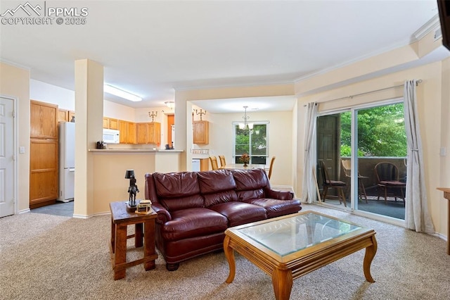 3847 Riviera Grv Unit 102, Colorado Springs, CO 80922 - living area featuring light carpet, crown molding, and a chandelier