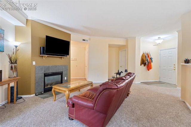 3847 Riviera Grv Unit 102, Colorado Springs, CO 80922 - carpeted living room featuring ornamental molding and a fireplace