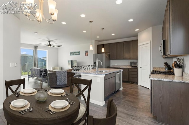 2481 Horsemanship Ct, Colorado Springs, CO 80922 - dining space with ceiling fan, a chandelier, recessed lighting, and dark wood-style floors
