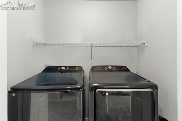 2481 Horsemanship Ct, Colorado Springs, CO 80922 - laundry area with washer and clothes dryer
