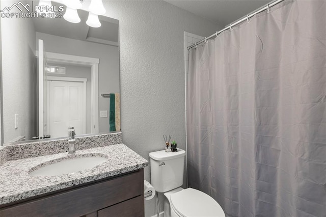 2481 Horsemanship Ct, Colorado Springs, CO 80922 - full bath with a textured wall, vanity, and a shower with curtain
