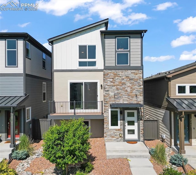 2481 Horsemanship Ct, Colorado Springs, CO 80922 - view of front of property featuring stone siding and board and batten siding