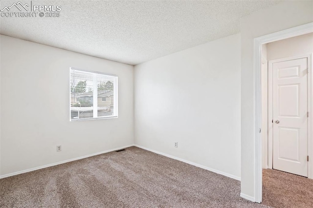 1275 Soaring Eagle Dr, Colorado Springs, CO 80915 - carpeted spare room featuring a textured ceiling and baseboards