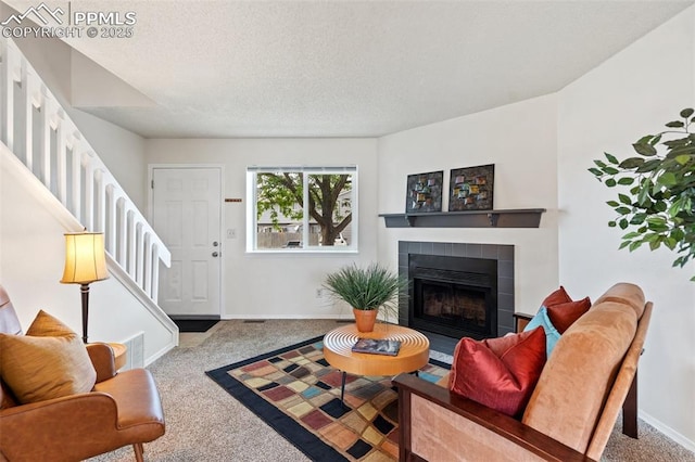 1275 Soaring Eagle Dr, Colorado Springs, CO 80915 - living room with stairway, carpet flooring, a fireplace, and a textured ceiling