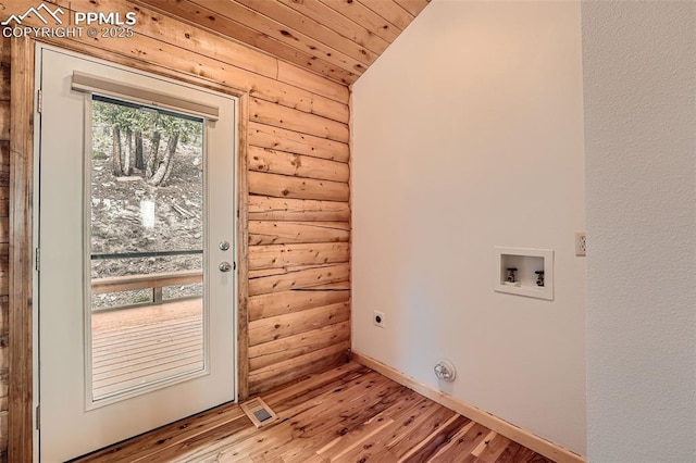1527 S Pine Dr, Bailey, CO 80421 - washroom featuring log walls, electric dryer hookup, wood finished floors, washer hookup, and wood ceiling