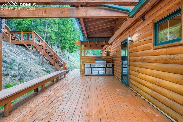 1527 S Pine Dr, Bailey, CO 80421 - wooden terrace with an outdoor kitchen and stairway