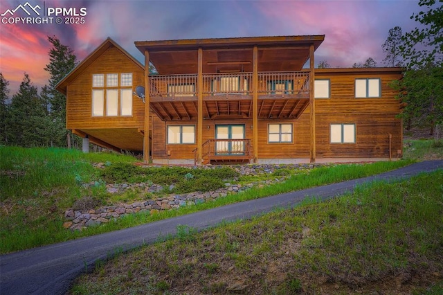 1527 S Pine Dr, Bailey, CO 80421 - back of property at dusk with a balcony