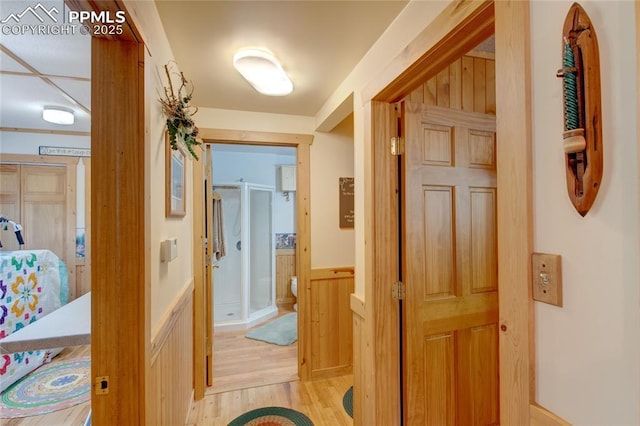 9615 Mountain Rd, Cascade, CO 80809 - corridor featuring wainscoting and light wood-type flooring