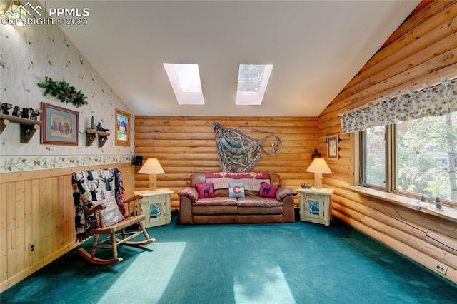 9615 Mountain Rd, Cascade, CO 80809 - carpeted living area with a skylight, rustic walls, lofted ceiling, and wainscoting