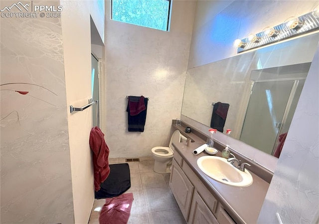 945 Marlstone Pl, Colorado Springs, CO 80904 - full bath featuring a stall shower, vanity, and tile patterned flooring